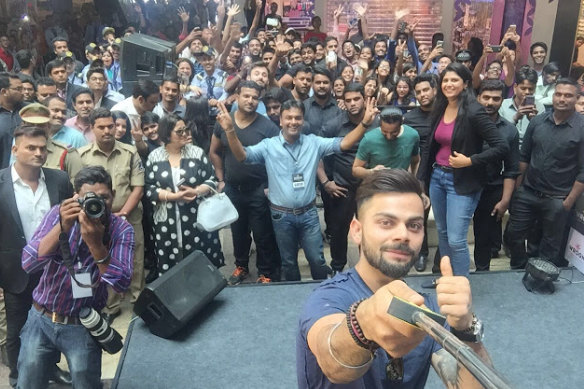 Another day at the office: Kohli takes a seflie at a Wrogn store launch in Hyderabad.