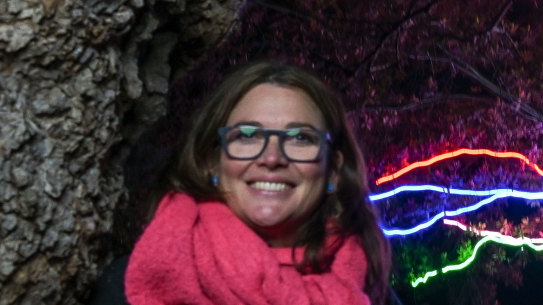 Royal Botanic Gardens creative producer Kara Ward in front of the neon tree installation.