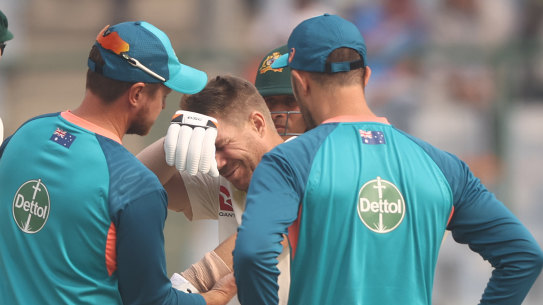David Warner receives medical treatment during his Delhi innings.