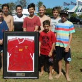 A young Josh Nisbet surrounded by some of his teammates at the Sunshine Coast Fire.