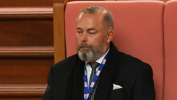 Andrew Landeryou, the husband of late Senator Kimberley Kitching, sits in the public gallery during a Senate condolence motion.