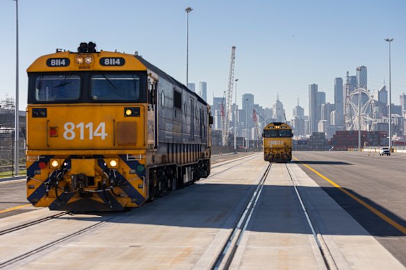 Freight trains at the Port of Melbourne’s Swanson Dock in front of a CBD backdrop.