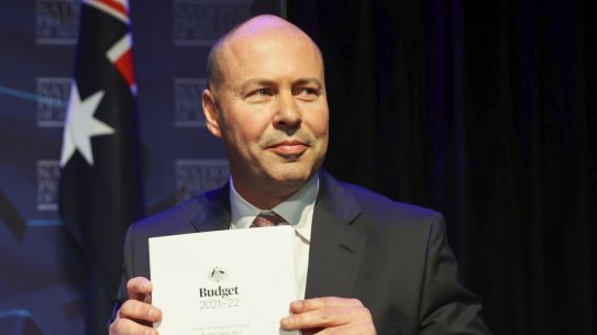 Treasurer Josh Frydenberg with the 2021-22 budget. Elements of that budget, and of last year’s mid-year update, are yet to be passed into law.