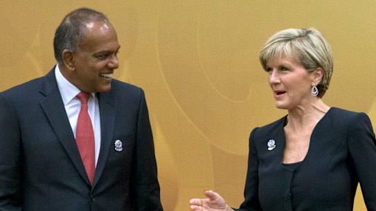 Then-Singaporean foreign minister Shanmugam speaks with Julie Bishop in 2015.