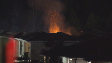 A woman has died and several people, including three children, were rushed to hospital after the house fire. 