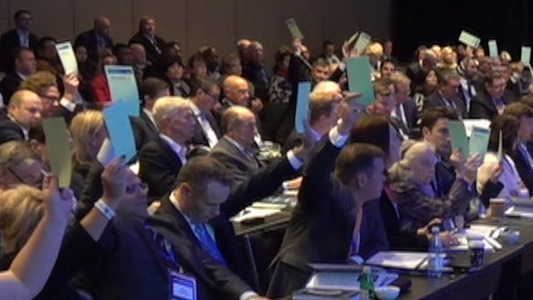 Liberal Party council members vote on a motion to sell the ABC in June. 