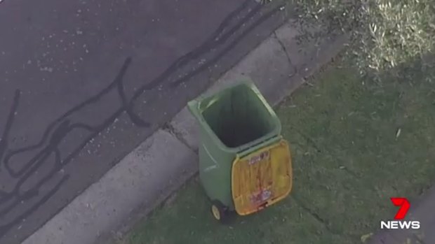 The body was discovered inside an abandoned rubbish bin.