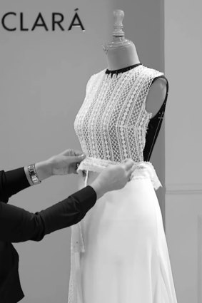 Designer Rosa Clara works on the wedding dress for Mery Perelló for her wedding with Rafael Nadal. The bodice, with jewel neckline and long sleeves, was made of beautiful Art Deco-inspired French lace with delicate patterning, flower motifs and microbeading on the meticulously hand-embroidered fabric. 