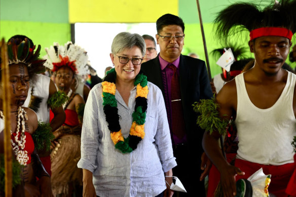 Penny Wong, pictured in Papua New Guinea, has visited 12 Pacific nations since the election.