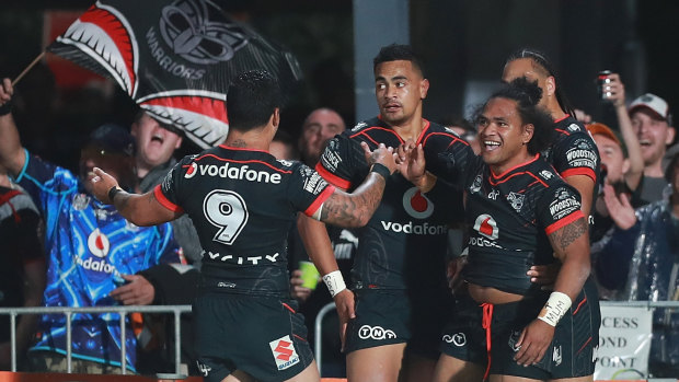 Early running: The home side celebrate a try to Ken Maumalo in the fifth minute at Mt Smart Stadium.