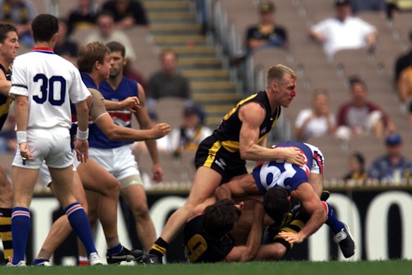Matthew Knights bleeds during a clash against the Bulldogs in 2001.