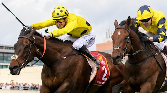 Mark Zahra (left) broke the whip rules when he won the Caulfield Cup on Without A Fight.