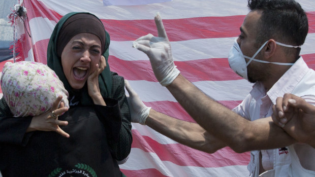 A Palestinian woman reacts in a first aid tent during a protest near Beit Lahiya, Gaza Strip.