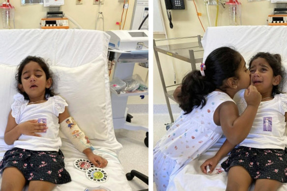 Tharnicaa and her sister Kopika in hospital on Christmas Island on June 6.