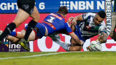 Wide man: Ken Maumalo scores close to the touchline for the Warriors.