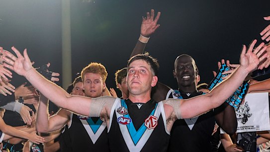 Zak Butters leads Port Adelaide off the ground after their stirring win over Geelong on Saturday.