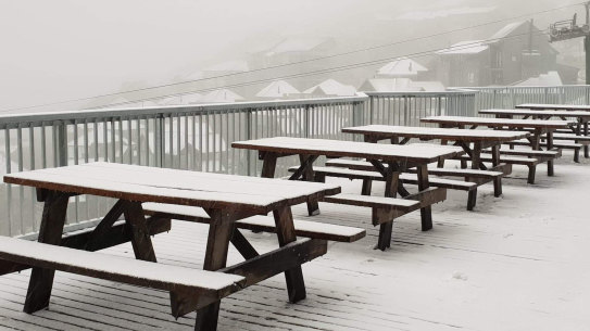 Snow blankets picnic tables at Mount Hotham in 2019. The weather bureau says snow in December is slightly more common than falls in January.