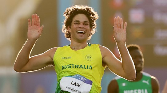 Calab Law celebrates Australia’s men’s 4x100m relay gold medal-winning race.