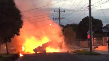 A light plane caught fire after crashing onto a street in Mordialloc