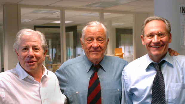 Former Washington Post executive editor Ben Bradlee, centre, poses with Watergate reporters Carl Bernstein, left, and Bob Woodward at the Washington Post in 2005. 