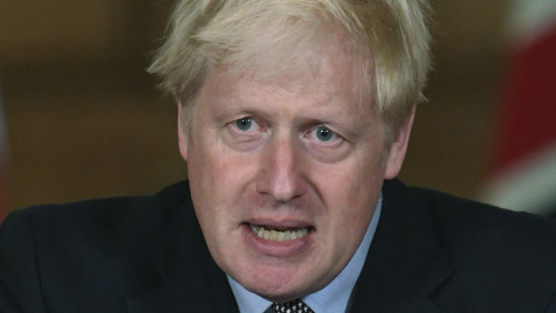 Britain's Prime Minister Boris Johnson announces restrictions.