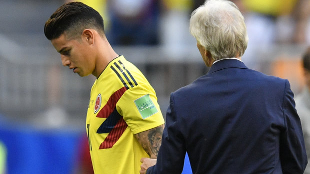 Injured: 2014 World Cup Golden Boot James Rodriguez leaves the field against Senegal. 