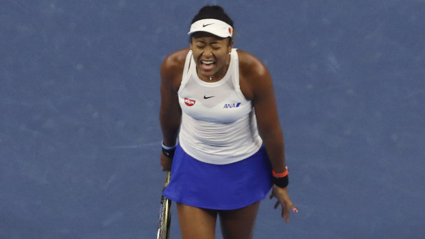 Naomi Osaka fought back after dropping the opening set of the decider in Beijing.