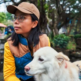 Pet psychic Yoyo Hsu communicates with her dog, Coffee, in Taipei, Taiwan. 