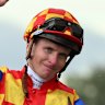 James McDonald salutes the crowd after winning the Rosehill Guineas on Autumn Boy.