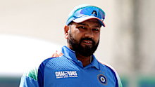 Rohit Sharma of India looks on as he waits for the coin toss