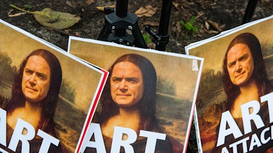 Posters at Wednesday's protest featured Arts Minister John Graham's face as the Mona Lisa.