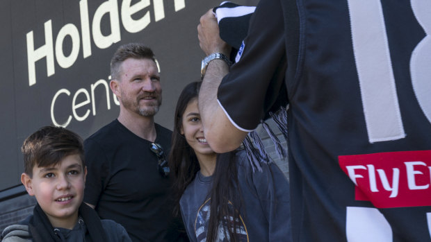 Nathan Buckley poses for photos with fans on Saturday morning. 