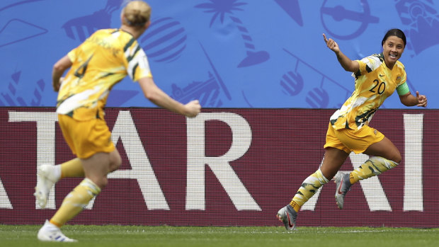 Sam Kerr celebrates scoring Australia's first goal in their opening World Cup match against Italy.