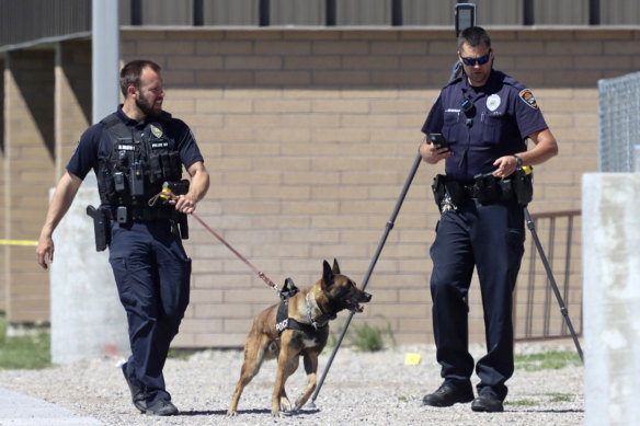 Police officers outside Rigby Middle School in Idaho following a shooting there on Thursday.