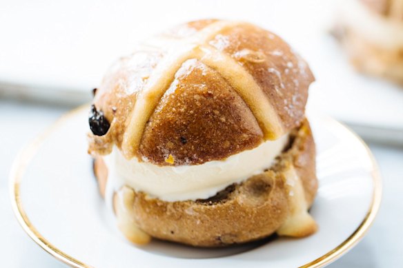 Use a cookie cutter to cut out discs of ice-cream for hot cross bun ice-cream sandwiches.