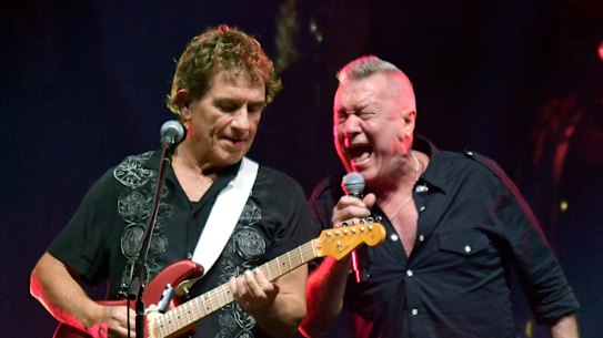 Ian Moss and Jimmy Barnes perform with Cold Chisel at Flemington Racecourse on Friday night.
