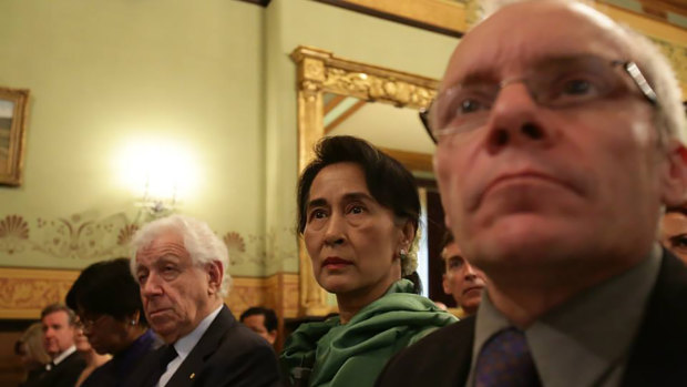 Sean Turnell, right, with Aung San Suu Kyi, centre, and Frank Lowy, left, at the Lowy Institute in 2013.