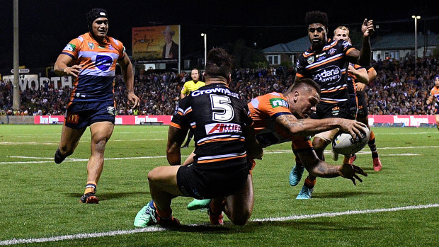 Late show: Shaun Kenny-Dowall launches himself across the line to snatch victory for the Tigers