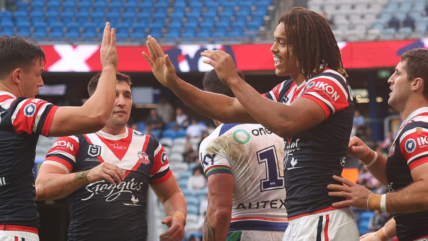 The Roosters celebrate a try to Dom Young.