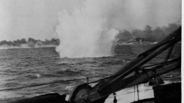 "Taken from a British ship, this picture shows water spurting skywards as an enemy shell falls harmlessly in to the sea." 