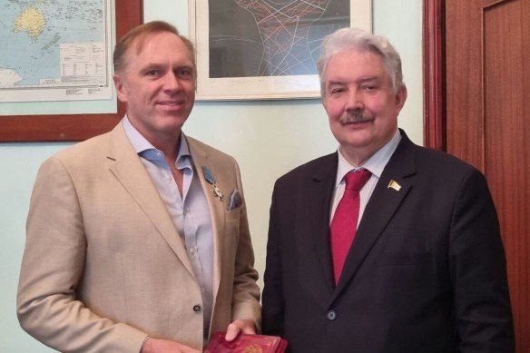 McRae said he received a Badge of Honour, the highest award of the International Slavic Academy, from opposition candidate Sergey Baburin.