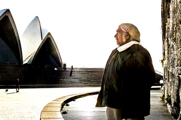 Artist Djon Mundine has suggested creating a large carving of Indigenous figures in the cliff face opposite the Sydney Opera House.