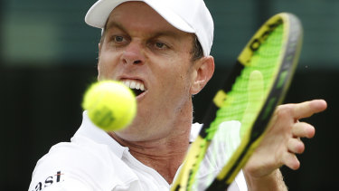 Big gun: Sam Querrey returns to Australia's John Millman on day six at Wimbledon.