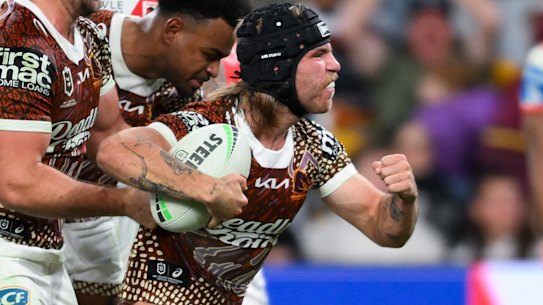 Blake Mozer celebrates scoring for the Broncos against the Dragons.