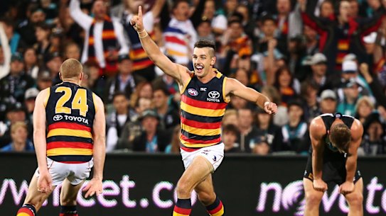 Overpowered: Taylor Walker helped Adelaide square the Showdown ledger against rivals Port.