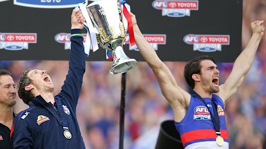 Former captains Easton Wood (right) and Bob Murphy roar after the Dogs' 2016 flag 