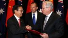 China's commerce minister  Gao Hucheng and then  prime minister Tony Abbott during the China-Australia FTA signing ceremony in Canberra in 2015.