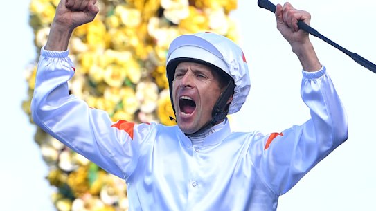 Hugh Bowman roars in triumph as he returns on Farnan after winning the Golden Slipper.