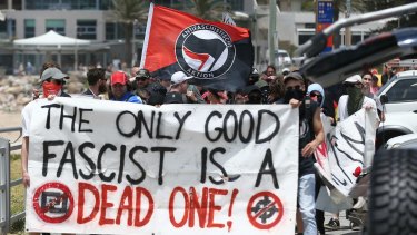 Members of an anti-fascist group in Cronulla at the anniversary of the Cronulla race riots.