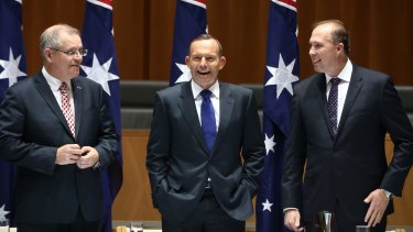 'Lapping at your door': Peter Dutton, then immigration minister (right), jokes in 2015 about rising sea levels in the Pacific with Tony Abbott (centre), the PM at the time.  Scott Morrison, then the social services minister, left.